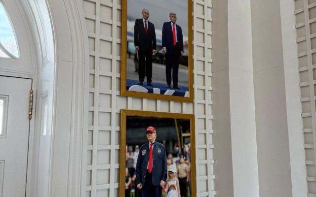 Putinlə çəkilmiş şəklini divardan asdı