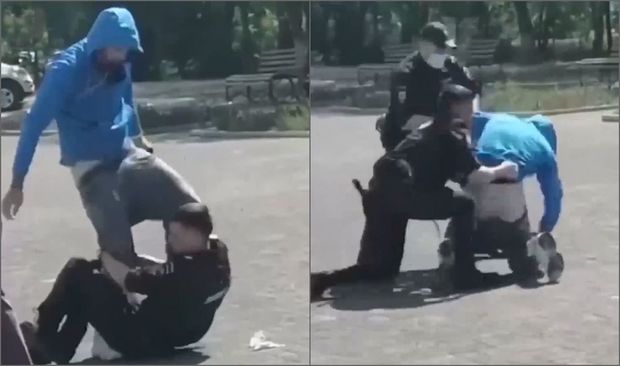 Polis maskasız gəncin dizlərindən yapışdı - VİDEO